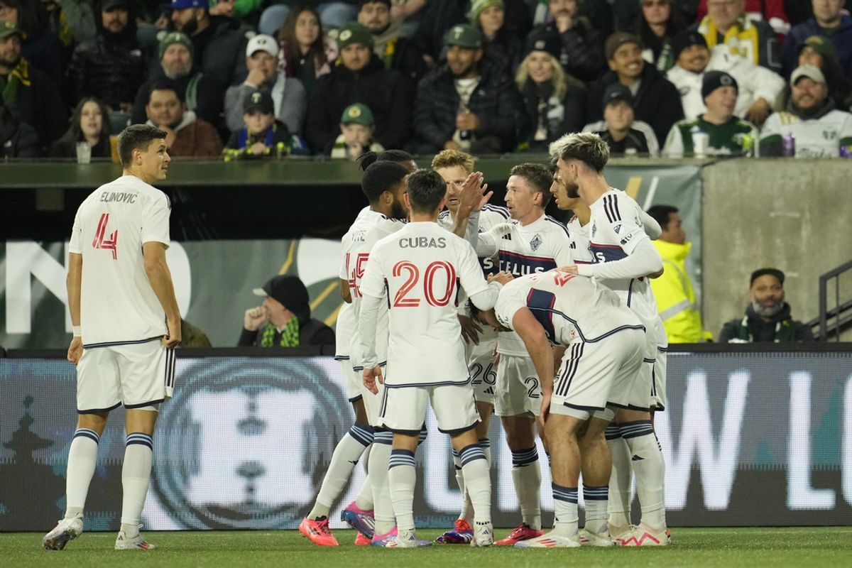 Oct 23, 2024; Portland, Oregon, USA;  Vancouver Whitecaps FC celebrate midfielder Ryan Gauld (25) goal during the first half against the Portland Timbers at Providence Park. Mandatory Credit: Soobum Im-Imagn Images