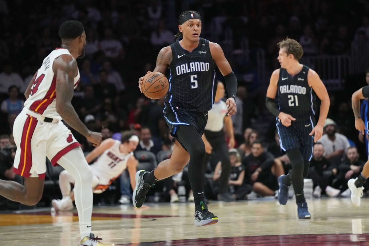 Oct 23, 2024; Miami, Florida, USA;  Orlando Magic forward Paolo Banchero (5) brings the ball up the court against the Miami Heat during the second half at Kaseya Center. Mandatory Credit: Jim Rassol-Imagn Images