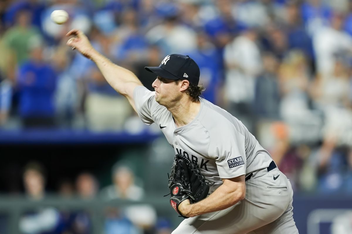 Oct 10, 2024; Kansas City, Missouri, USA; New York Yankees pitcher Gerrit Cole (45) pitches during the seventh inning against the Kansas City Royals in game four of the ALDS for the 2024 MLB Playoffs at Kauffman Stadium. Mandatory Credit: Jay Biggerstaff-Imagn Images