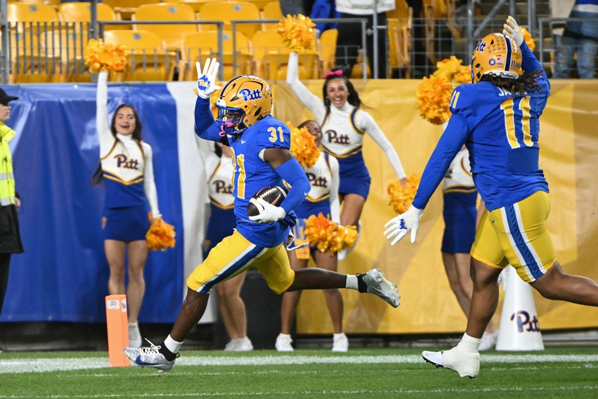 Oct 24, 2024; Pittsburgh, Pennsylvania, USA; Pittsburgh Panthers linebacker Rasheem Biles (31) returns an interception for a touchdown against the Syracuse Orange during the first quarter  at Acrisure Stadium. Mandatory Credit: Barry Reeger-Imagn Images