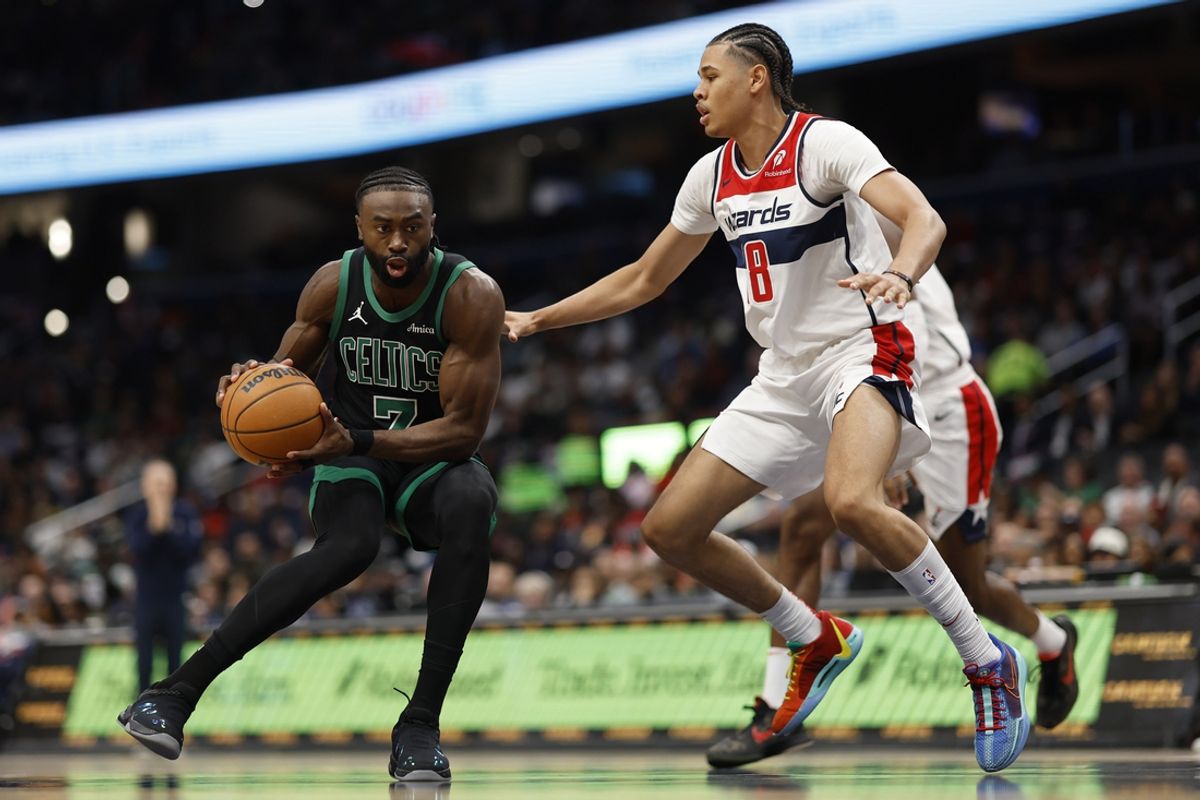 Oct 24, 2024; Washington, District of Columbia, USA; Boston Celtics guard Jaylen Brown (7) drives to the basket as Washington Wizards forward Kyshawn George (18) defends in the first half at Capital One Arena. Mandatory Credit: Geoff Burke-Imagn Images
