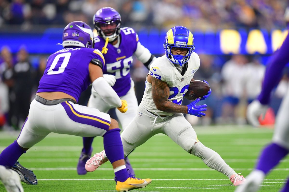Oct 24, 2024; Inglewood, California, USA;  Los Angeles Rams running back Kyren Williams (23) runs the ball against Minnesota Vikings linebacker Ivan Pace Jr. (0) during the first half at SoFi Stadium. Mandatory Credit: Gary A. Vasquez-Imagn Images