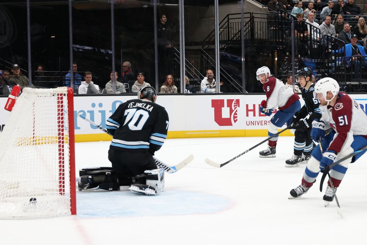 Oct 24, 2024; Salt Lake City, Utah, USA; Colorado Avalanche defenseman Cale Makar (8) scores against Utah Hockey Club goaltender Karel Vejmelka (70) during the first period at Delta Center. Mandatory Credit: Rob Gray-Imagn Images