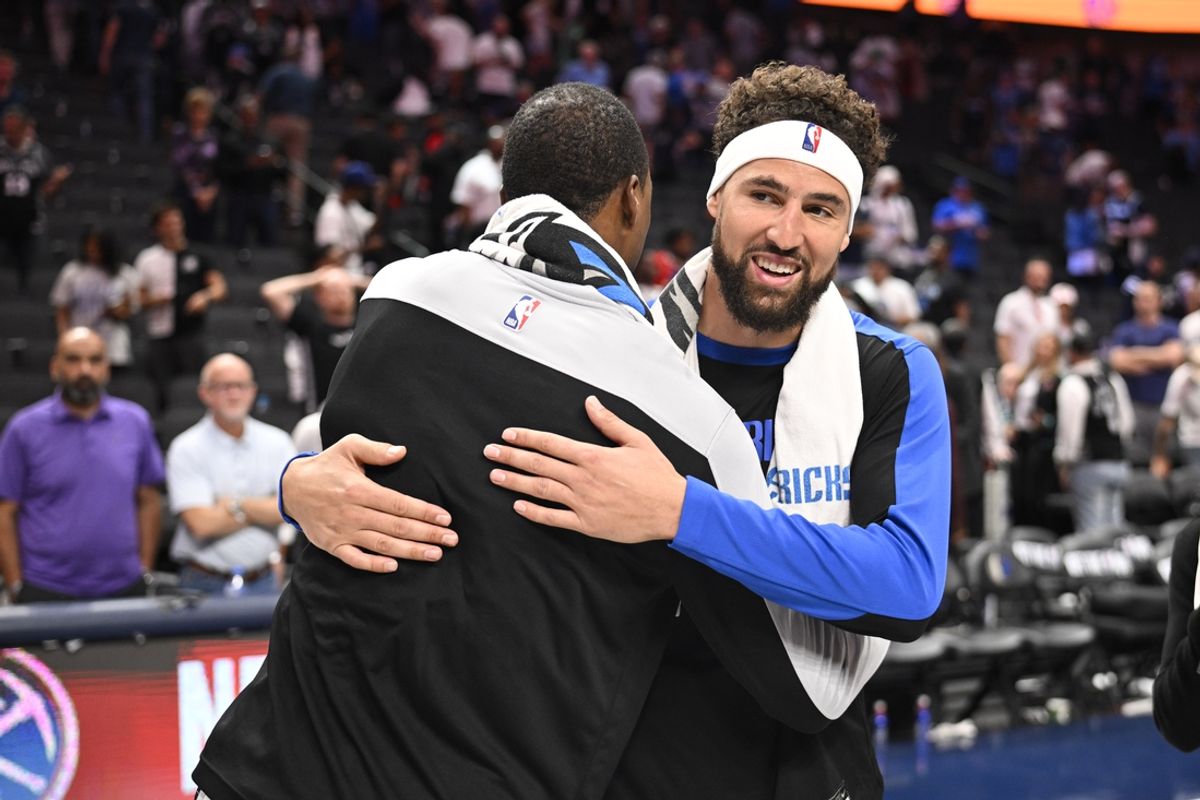 Oct 24, 2024; Dallas, Texas, USA; San Antonio Spurs forward Harrison Barnes (40) hugs Dallas Mavericks guard Klay Thompson (31) after the game at the American Airlines Center. Mandatory Credit: Jerome Miron-Imagn Images