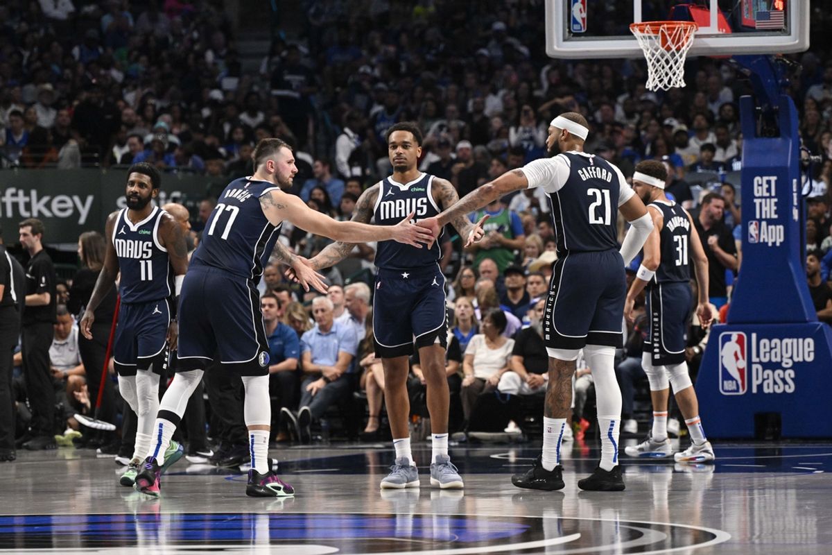 Oct 24, 2024; Dallas, Texas, USA; Dallas Mavericks guard Kyrie Irving (11) and guard Luka Doncic (77) and forward P.J. Washington (25) and center Daniel Gafford (21) and guard Klay Thompson (31) huddle up during the second half against the San Antonio Spurs at the American Airlines Center. Mandatory Credit: Jerome Miron-Imagn Images