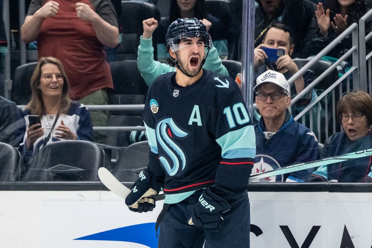 Oct 24, 2024; Seattle, Washington, USA;  Seattle Kraken forward Matty Beniers (10) celebrates after scoring a goal during the first period against the Winnipeg Jets at Climate Pledge Arena. Mandatory Credit: Stephen Brashear-Imagn Images