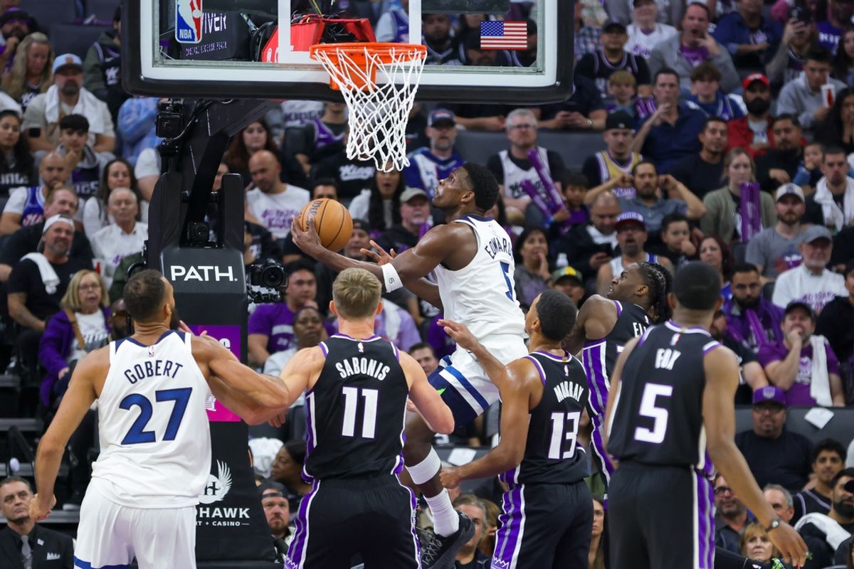 Oct 24, 2024; Sacramento, California, USA; Minnesota Timberwolves guard Anthony Edwards (5) drives to the basket against Sacramento Kings forward Keegan Murray (13) during the second quarter at Golden 1 Center. Mandatory Credit: Sergio Estrada-Imagn Images