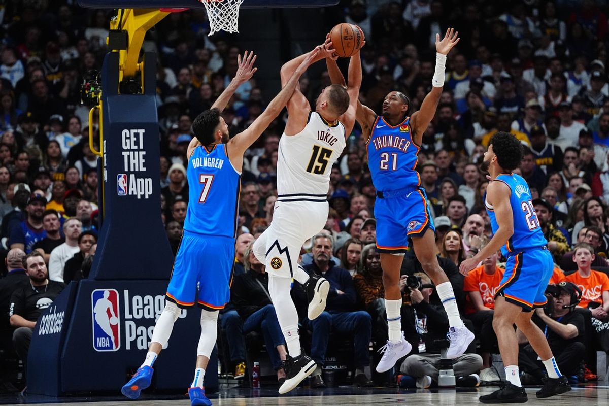 Oct 24, 2024; Denver, Colorado, USA; Oklahoma City Thunder forward Chet Holmgren (7) and guard Aaron Wiggins (21) and  guard Ajay Mitchell (25) defend on Denver Nuggets center Nikola Jokic (15) in the second quarter at Ball Arena. Mandatory Credit: Ron Chenoy-Imagn Images