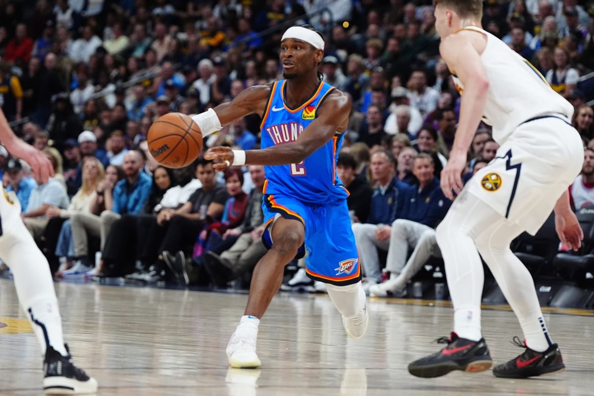 Oct 24, 2024; Denver, Colorado, USA; Oklahoma City Thunder guard Shai Gilgeous-Alexander (2) passes the ball in the second quarter against the Denver Nuggets at Ball Arena. Mandatory Credit: Ron Chenoy-Imagn Images