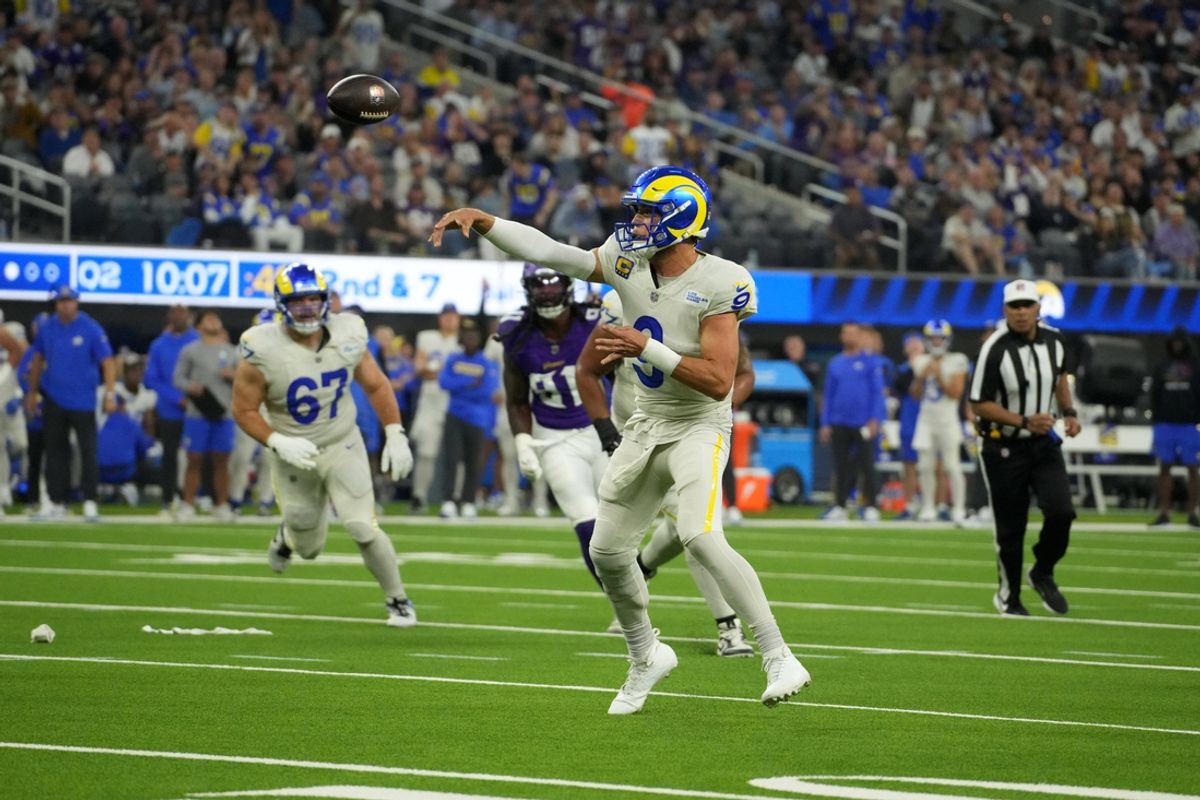 Los Angeles Rams quarterback Matthew Stafford (9) throws a 7-yard touchdown pass against the Minnesota Vikings in the first half at SoFi Stadium. Mandatory Credit: Kirby Lee-Imagn Images