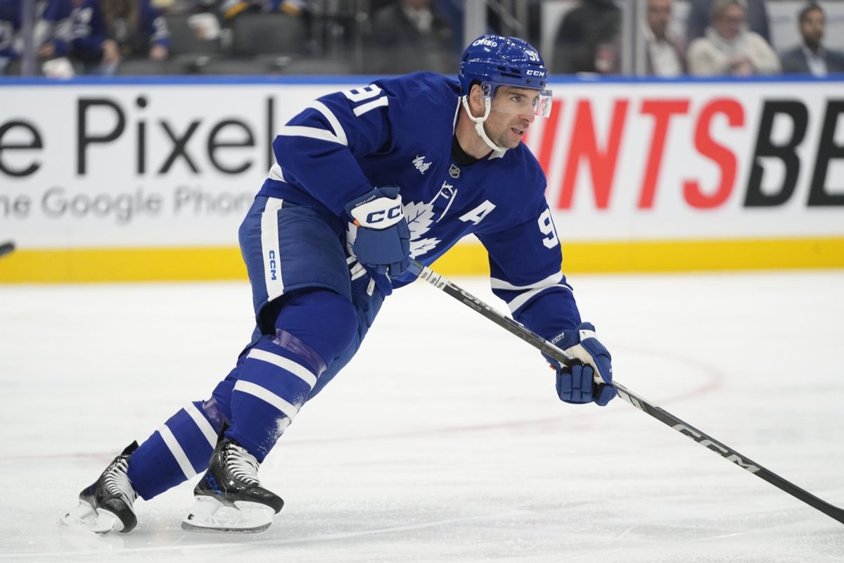 Oct 24, 2024; Toronto, Ontario, CAN; Toronto Maple Leafs forward John Tavares (91) skates against the St. Louis Blues during the first period at Scotiabank Arena. Mandatory Credit: John E. Sokolowski-Imagn Images