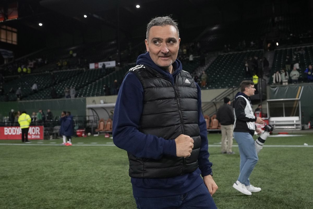 Oct 23, 2024; Portland, Oregon, USA;  Vancouver Whitecaps FC head coach Vanni Sartini celebrates the win against the Portland Timbers at Providence Park. Mandatory Credit: Soobum Im-Imagn Images