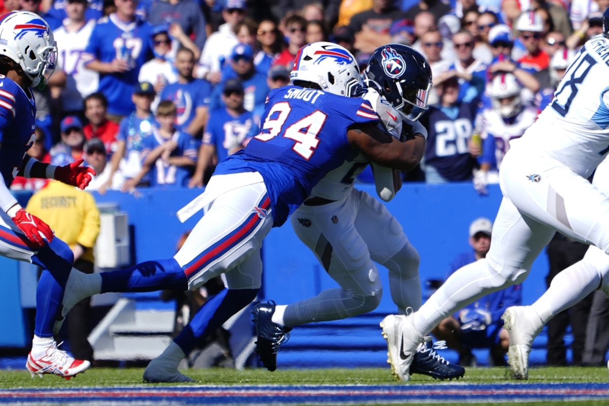 Oct 20, 2024; Orchard Park, New York, USA; Buffalo Bills defensive end Dawuane Smoot (94) tackles Tennessee Titans running back Tony Pollard (20) during the first half at Highmark Stadium. Mandatory Credit: Gregory Fisher-Imagn Images