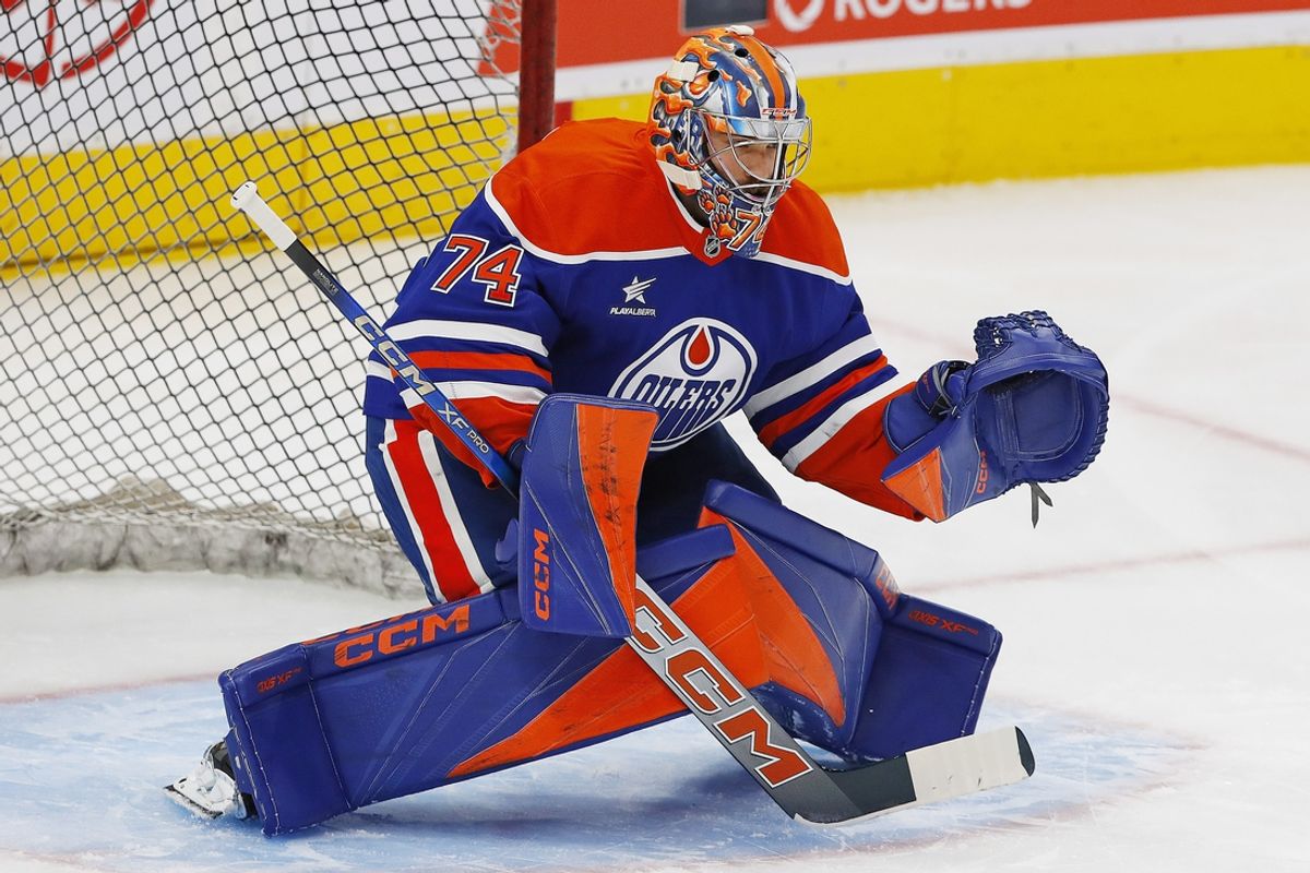 Oct 22, 2024; Edmonton, Alberta, CAN; Edmonton Oilers goaltender Stuart Skinner (74) makes a save during warmup against the  Carolina Hurricanes at Rogers Place. Mandatory Credit: Perry Nelson-Imagn Images