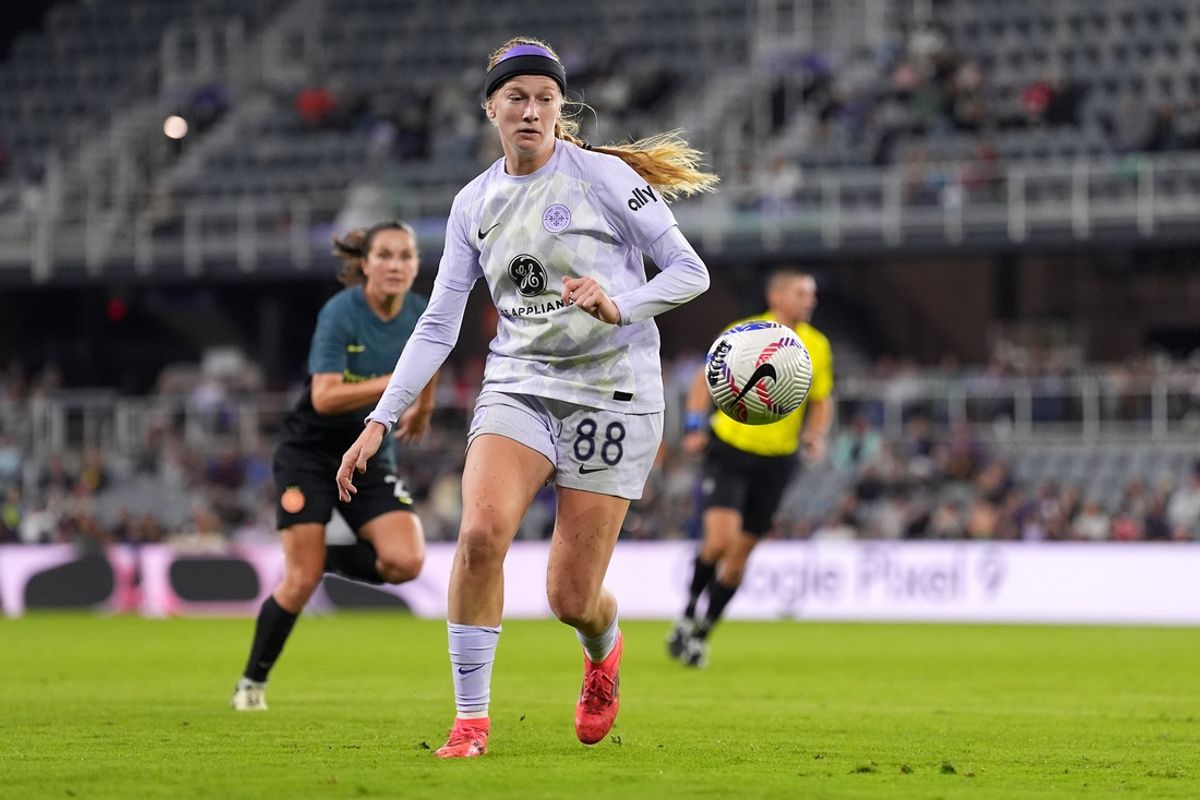 Oct 19, 2024; Louisville, Kentucky, USA; Racing Louisville forward FC Bethany Balcer (88) eyes the ball during the second half of a match against Portland Thorns FC at Lynn Family Stadium. Mandatory Credit: Kareem Elgazzar-Imagn Images