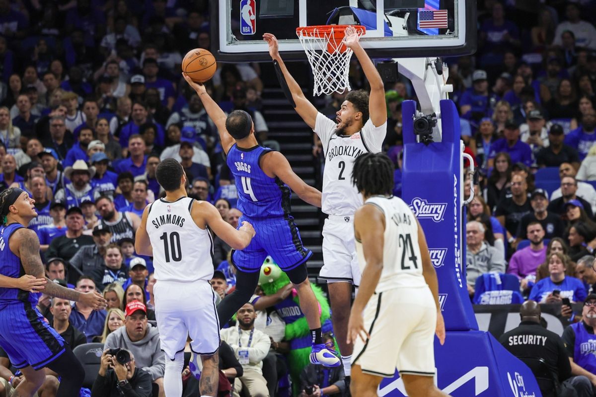 Oct 25, 2024; Orlando, Florida, USA; Orlando Magic guard Jalen Suggs (4) goes to the basket against Brooklyn Nets forward Cameron Johnson (2) during the second quarter at Kia Center. Mandatory Credit: Mike Watters-Imagn Images