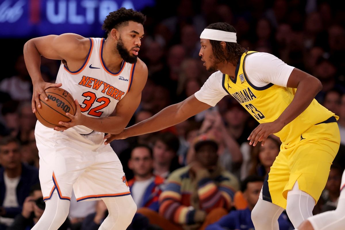 Oct 25, 2024; New York, New York, USA; New York Knicks center Karl-Anthony Towns (32) controls the ball against Indiana Pacers center Myles Turner (33) during the second quarter at Madison Square Garden. Mandatory Credit: Brad Penner-Imagn Images