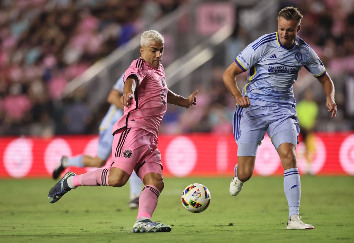 Oct 25, 2024; Fort Lauderdale, Florida, USA; Inter Miami CF forward Luis Suarez (9) battles Atlanta United defender Stian Gregersen (5) for control of the ball during the first half in a 2024 MLS Cup Playoffs Round One match  at Chase Stadium. Mandatory Credit: Sam Navarro-Imagn Images