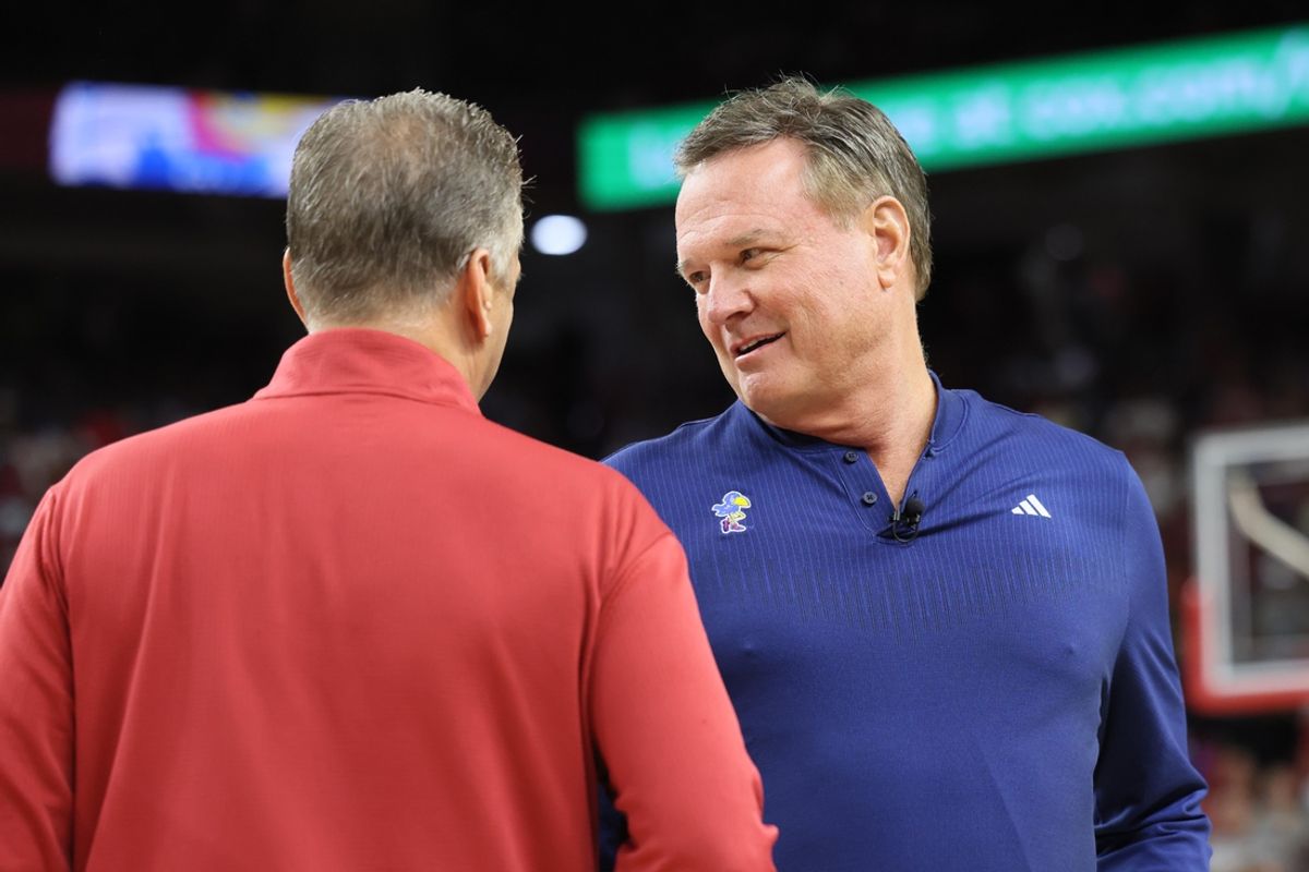 Oct 25, 2024; Fayetteville, AR, USA; Arkansas Razorbacks head coach John Calipari talks to Kansas Jayhawks head coach Bill Self prior to the game at Bud Walton Arena. Mandatory Credit: Nelson Chenault-Imagn Images