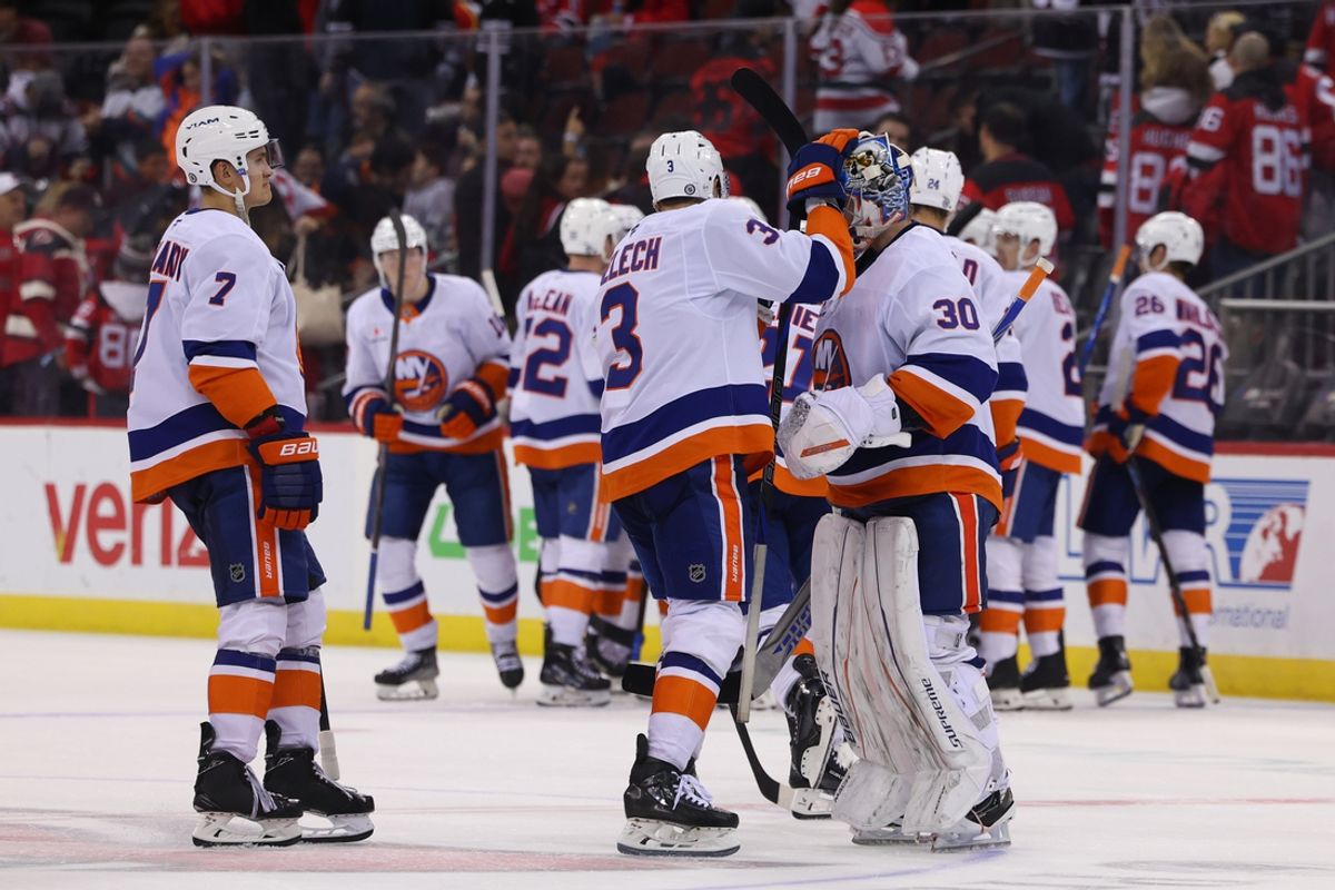 Oct 25, 2024; Newark, New Jersey, USA; The New York Islanders celebrate their overtime win over the New Jersey Devils at Prudential Center. Mandatory Credit: Ed Mulholland-Imagn Images