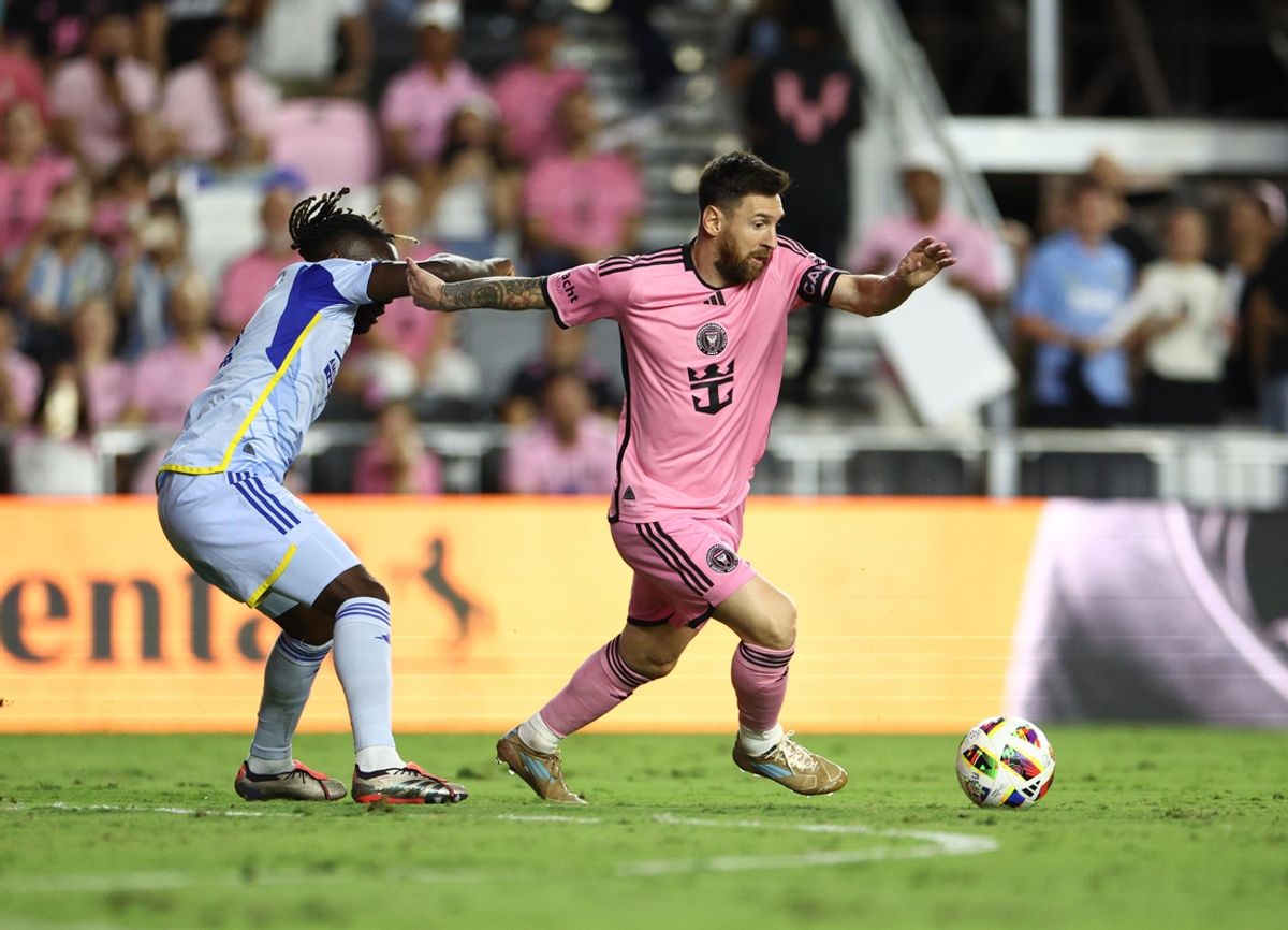 Oct 25, 2024; Fort Lauderdale, Florida, USA; Atlanta United midfielder Tristan Muyumba (8) battles Inter Miami CF forward Lionel Messi (10) for control of the ball during the second half in a 2024 MLS Cup Playoffs Round One match  at Chase Stadium. Mandatory Credit: Nathan Ray Seebeck-Imagn Images