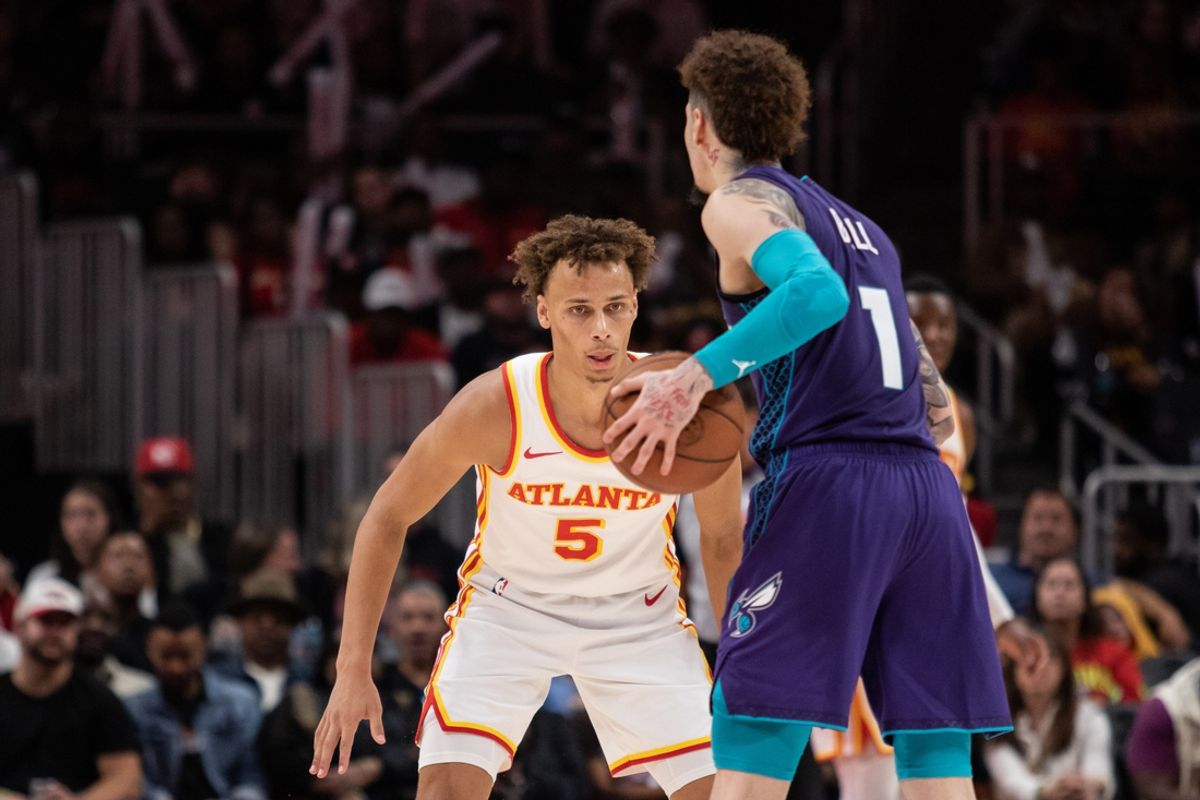 Oct 25, 2024; Atlanta, Georgia, USA; Atlanta Hawks guard Dyson Daniels (5) plays defense against Charlotte Hornets guard LaMelo Ball (1) during the fourth quarter at State Farm Arena. Mandatory Credit: Jordan Godfree-Imagn Images