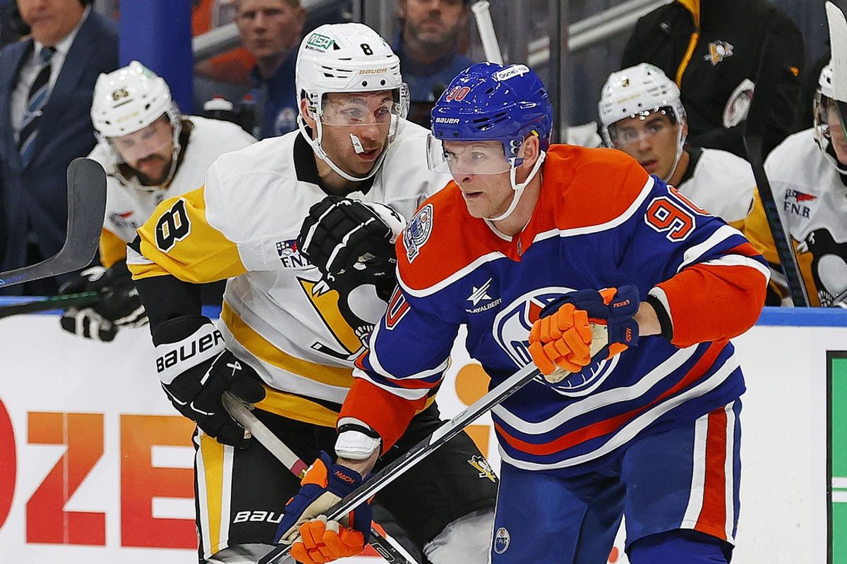 Oct 25, 2024; Edmonton, Alberta, CAN; Edmonton Oilers forward Corey Perry (90) and Pittsburgh Penguins forward Michael Bunting (8) battles for position during the second period at Rogers Place. Mandatory Credit: Perry Nelson-Imagn Images