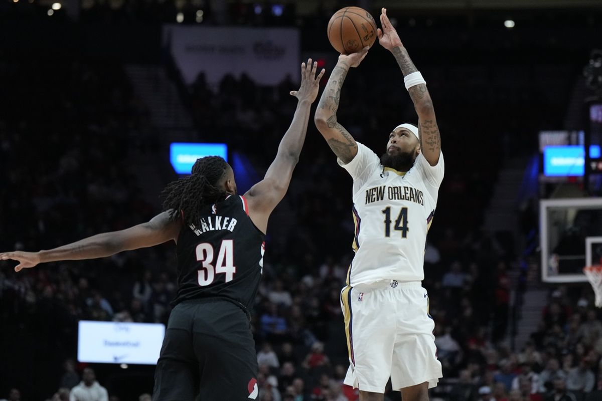 Oct 25, 2024; Portland, Oregon, USA; New Orleans Pelicans small forward Brandon Ingram (14) shoots the ball over Portland Trail Blazers forward Jabari Walker (34) during the first half at Moda Center. Mandatory Credit: Soobum Im-Imagn Images