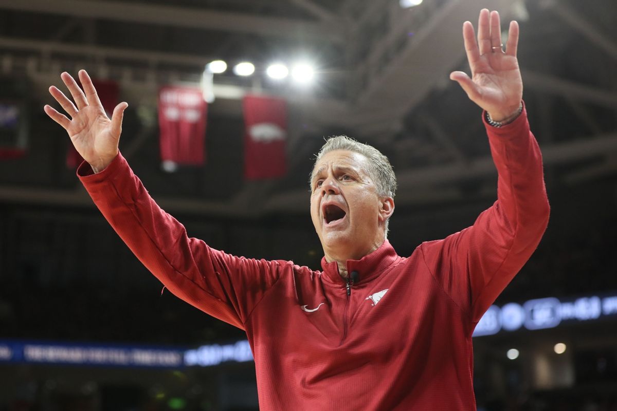 Oct 25, 2024; Fayetteville, AR, USA; Arkansas Razorbacks head coach John Calipari quiets the crowd as they began chanting “overrated” late in the second half against the Kansas Jayhawks at Bud Walton Arena. Mandatory Credit: Nelson Chenault-Imagn Images