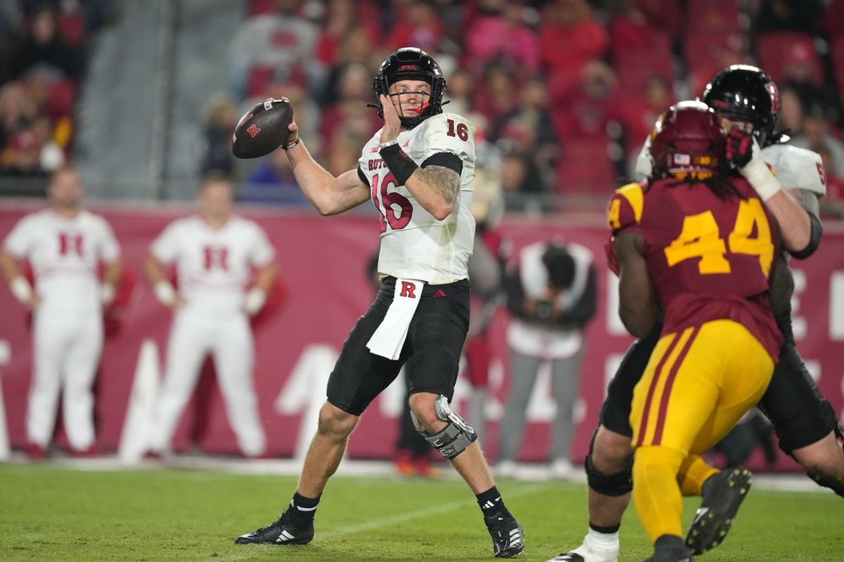 Oct 25, 2024; Los Angeles, California, USA; Rutgers Scarlet Knights quarterback Athan Kaliakmanis (16) throws the ball against the Southern California Trojans in the second half at United Airlines Field at Los Angeles Memorial Coliseum. Mandatory Credit: Kirby Lee-Imagn Images