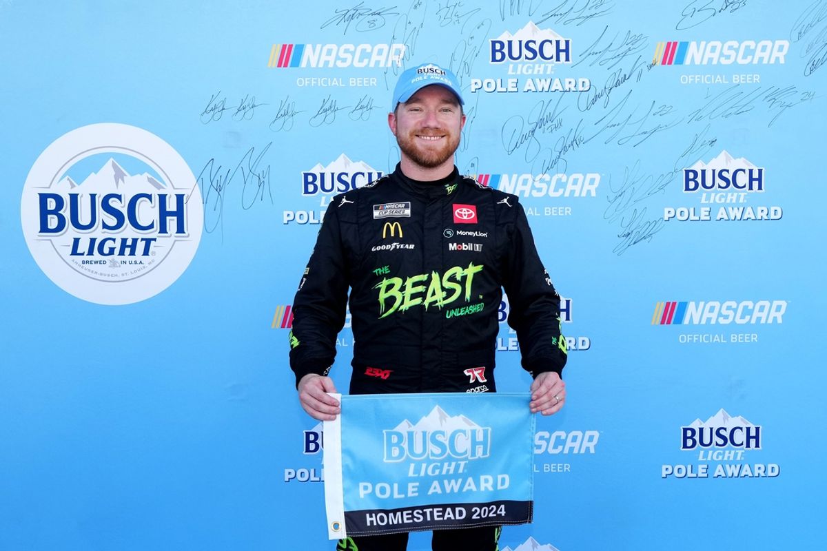 Oct 26, 2024; Homestead, Florida, USA; NASCAR Cup Series driver Tyler Reddick (45) poses for a photo after winning the pole for the Straight Talk Wireless 400 at Homestead-Miami Speedway. Mandatory Credit: Jasen Vinlove-Imagn Images
