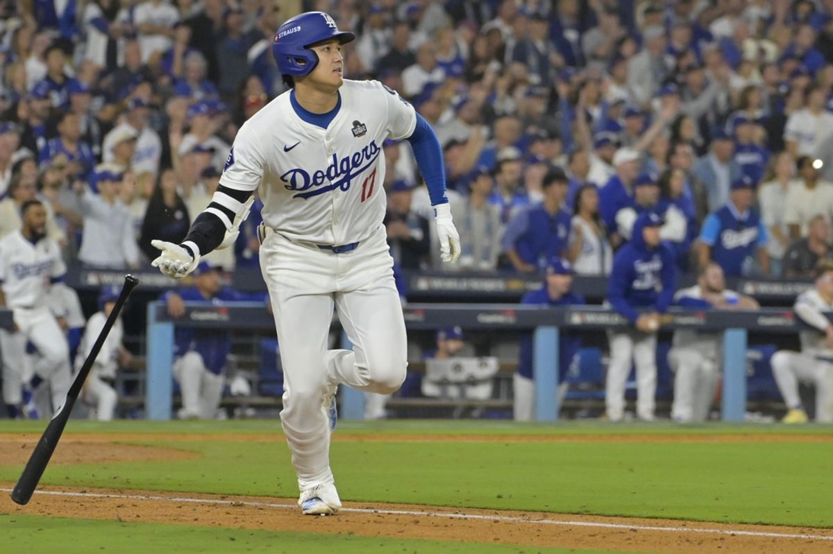 Oct 25, 2024; Los Angeles, California, USA; Los Angeles Dodgers designated hitter player Shohei Ohtani (17) hits a double in the eighth inning against the New York Yankees during game one of the 2024 MLB World Series at Dodger Stadium. Mandatory Credit:  Jayne Kamin-Oncea-Imagn Images