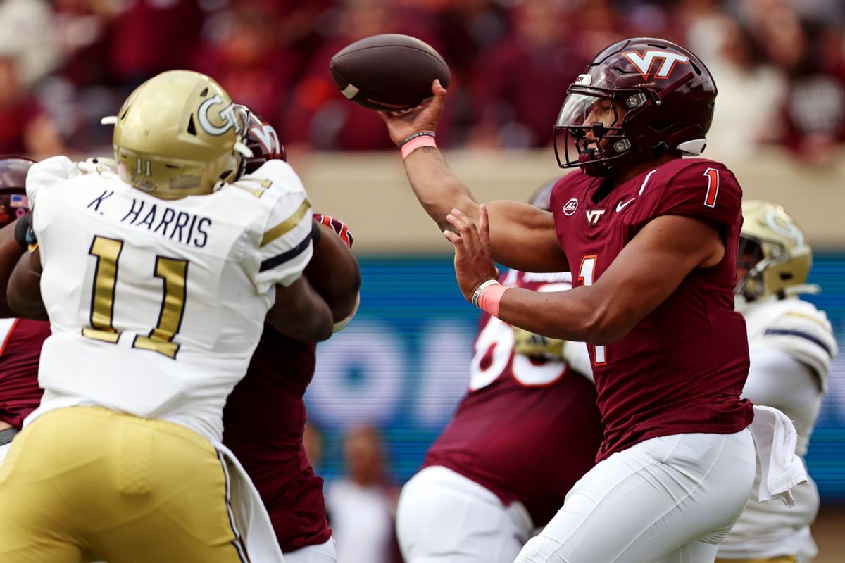 Oct 26, 2024; Blacksburg, Virginia, USA; Virginia Tech Hokies quarterback Kyron Drones (1) throws a pass during the first quarter against the Georgia Tech Yellow Jackets at Lane Stadium. Mandatory Credit: Peter Casey-Imagn Images