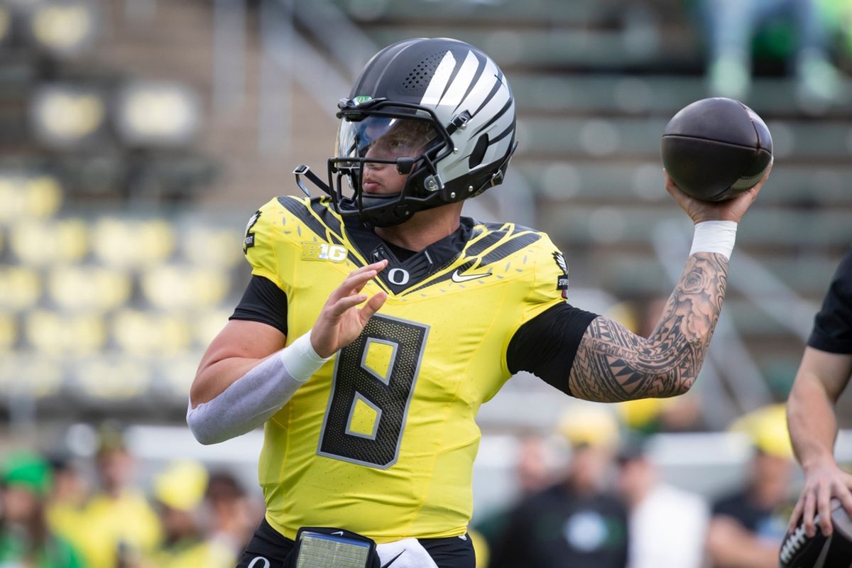 Oregon quarterback Dillon Gabriel throws a pass during warmups as the No. 1 Oregon Ducks host the No. 21 Illinois Fighting Illini Saturday, Oct. 26, 2024 at Autzen Stadium in Eugene, Ore.