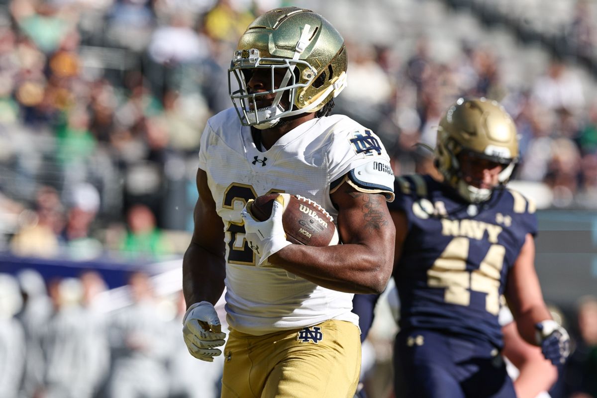 Oct 26, 2024; East Rutherford, New Jersey, USA; Notre Dame Fighting Irish running back Kedren Young (21) celebrates a rushing touchdown during the second half against the Navy Midshipmen at MetLife Stadium. Mandatory Credit: Vincent Carchietta-Imagn Images