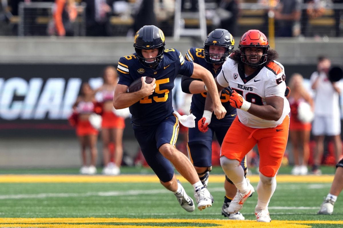 Oct 26, 2024; Berkeley, California, USA; California Golden Bears quarterback Fernando Mendoza (15) carries the ball against the Oregon State Beavers during the second quarter at California Memorial Stadium. Mandatory Credit: Darren Yamashita-Imagn Images