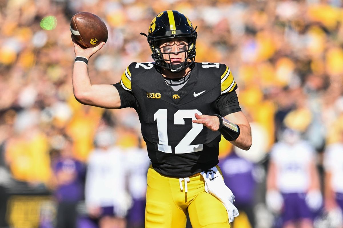 Oct 26, 2024; Iowa City, Iowa, USA; Iowa Hawkeyes quarterback Cade McNamara throws a pass against the Northwestern Wildcats during the first quarter at Kinnick Stadium. Mandatory Credit: Jeffrey Becker-Imagn Images