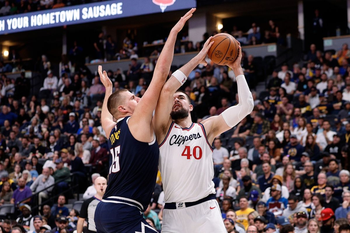 Oct 26, 2024; Denver, Colorado, USA; Los Angeles Clippers center Ivica Zubac (40) controls the ball under pressure from Denver Nuggets center Nikola Jokic (15) in the second quarter at Ball Arena. Mandatory Credit: Isaiah J. Downing-Imagn Images