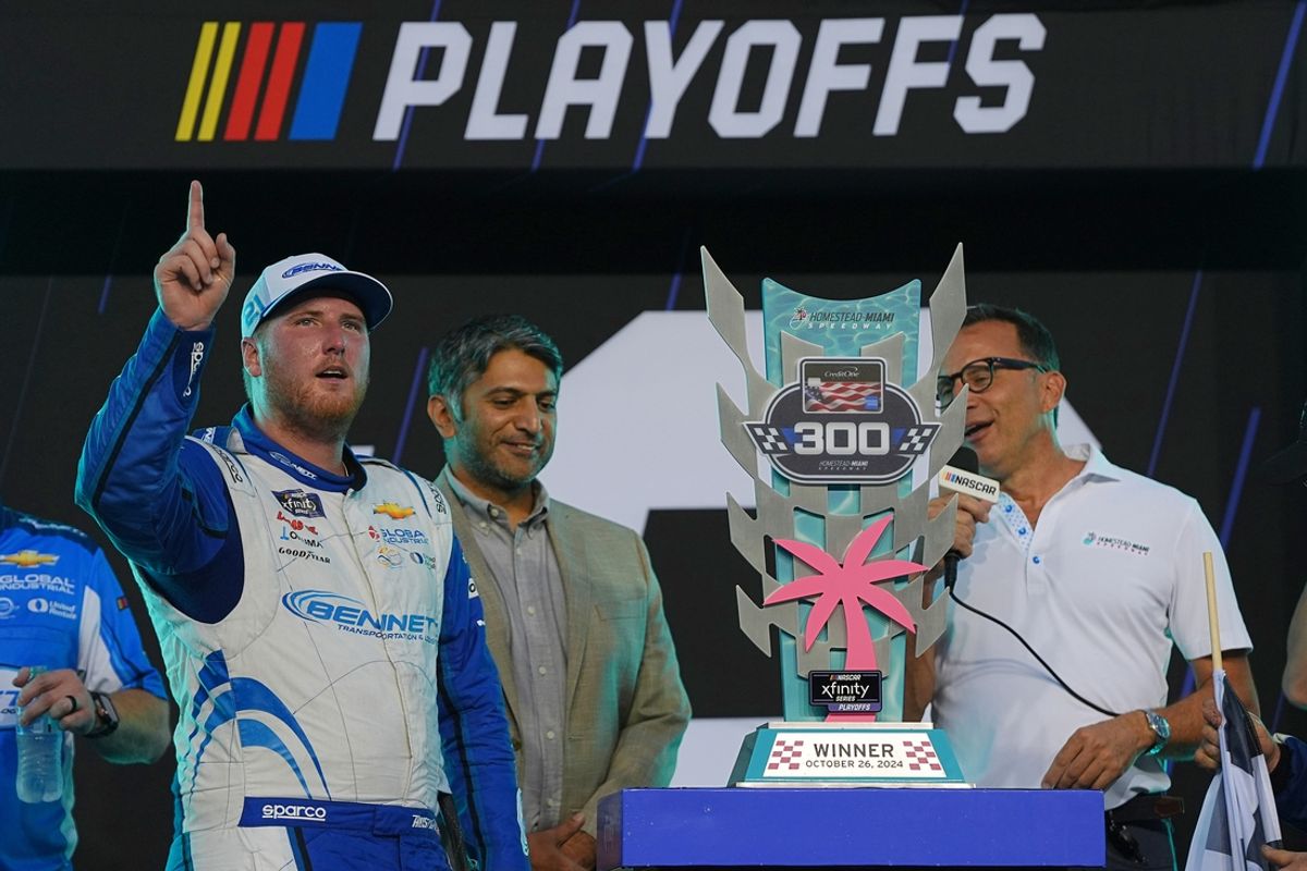 Oct 26, 2024; Homestead, Florida, USA; Xfinity Series driver Austin Hill (21) celebrates after winning the Credit One NASCAR AMEX Credit Card 300 at Homestead-Miami Speedway. Mandatory Credit: Jasen Vinlove-Imagn Images