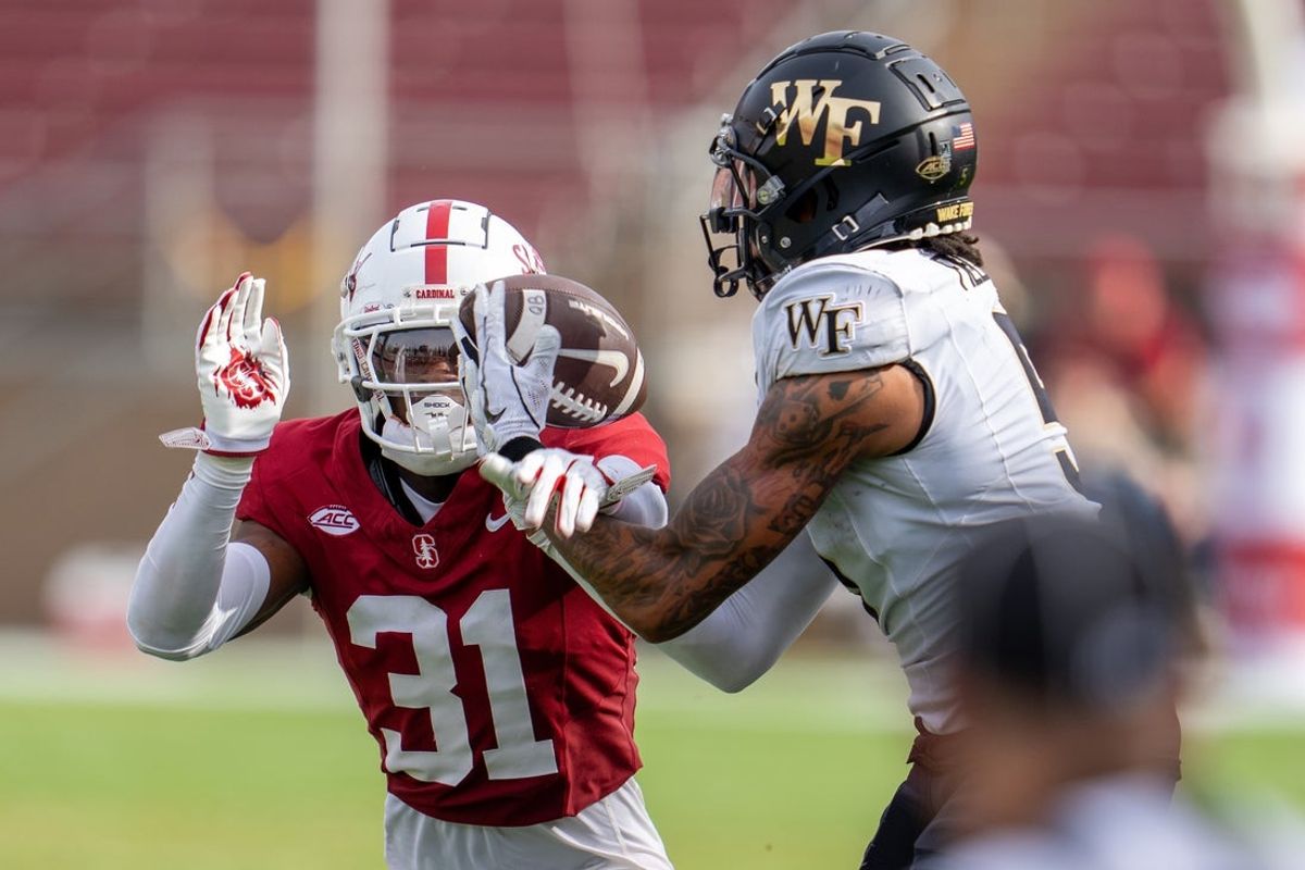Oct 26, 2024; Stanford, California, USA;  Stanford Cardinal cornerback Aaron Morris (31) breaks up a pass to Wake Forest Demon Deacons wide receiver Horatio Fields (5) during the third quarter at Stanford Stadium. Mandatory Credit: Neville E. Guard-Imagn Images