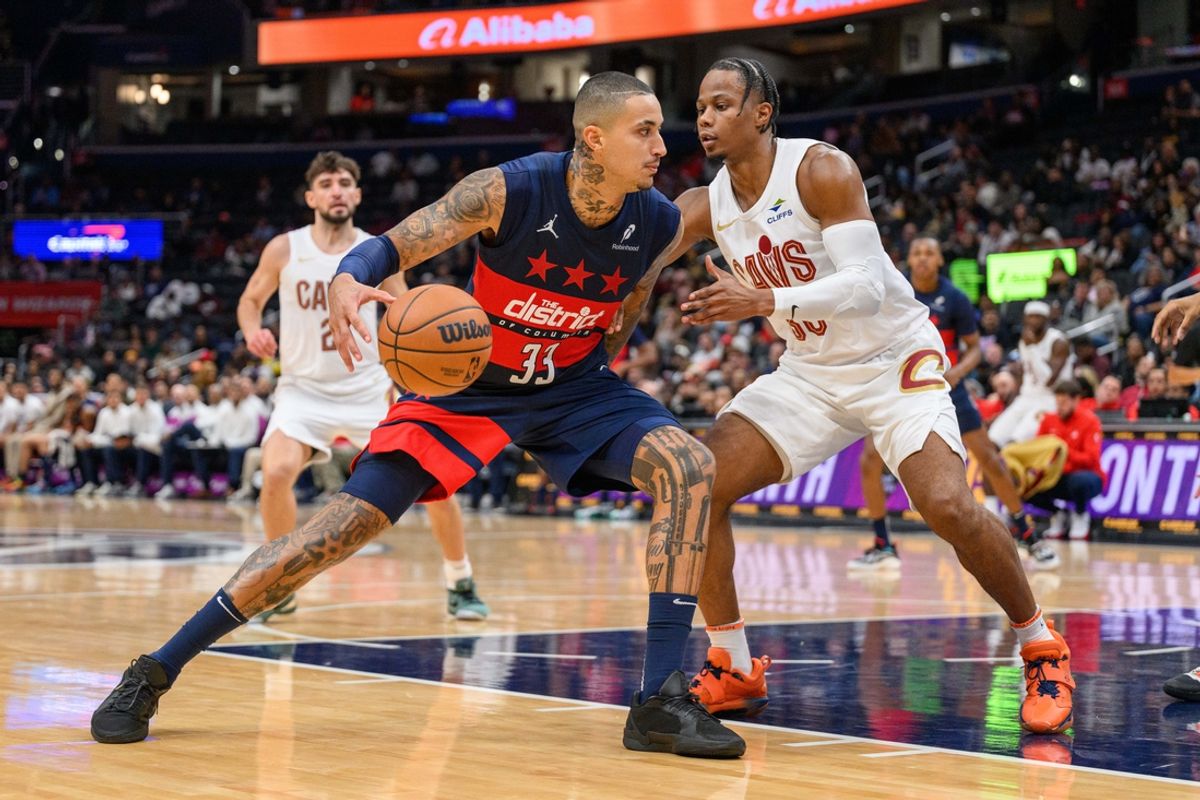 Oct 26, 2024; Washington, District of Columbia, USA; Washington Wizards forward Kyle Kuzma (33) dribbles the ball against Cleveland Cavaliers forward Isaac Okoro (35) during the second quarter at Capital One Arena. Mandatory Credit: Reggie Hildred-Imagn Images
