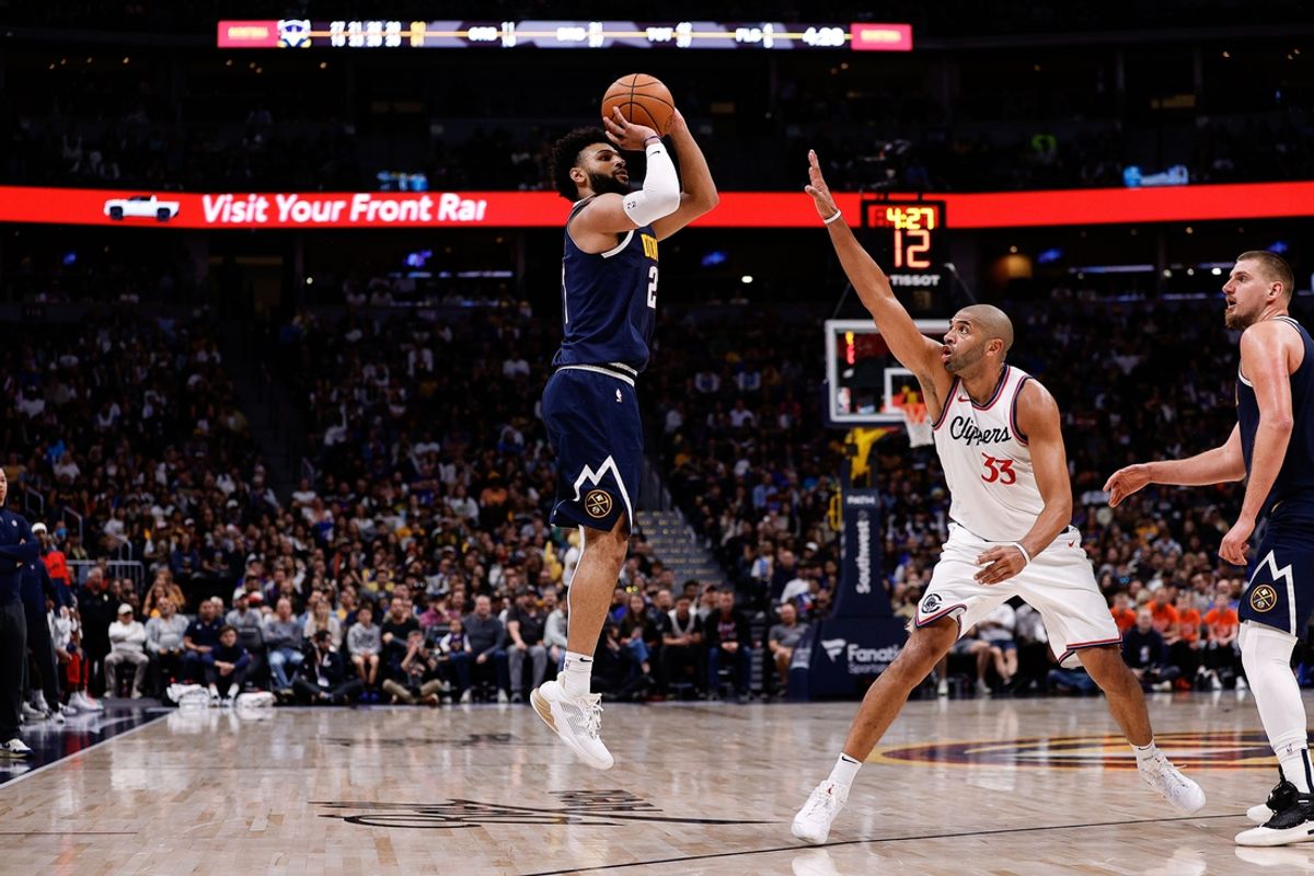 Oct 26, 2024; Denver, Colorado, USA; Denver Nuggets guard Jamal Murray (27) attempts a shot as Los Angeles Clippers forward Nicolas Batum (33) defends in the fourth quarter at Ball Arena. Mandatory Credit: Isaiah J. Downing-Imagn Images