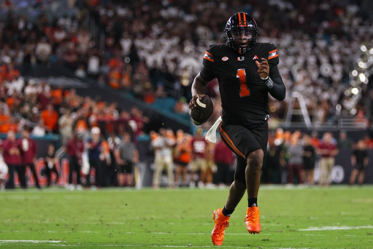 Oct 26, 2024; Miami Gardens, Florida, USA; Miami Hurricanes quarterback Cam Ward (1) runs with the football against the Florida State Seminoles during the second quarter at Hard Rock Stadium. Mandatory Credit: Sam Navarro-Imagn Images