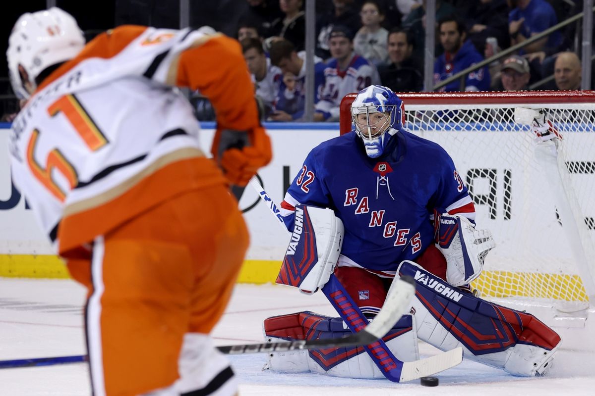 Oct 26, 2024; New York, New York, USA; New York Rangers goaltender Jonathan Quick (32) makes a save in front of Anaheim Ducks left wing Cutter Gauthier (61) during the second period at Madison Square Garden. Mandatory Credit: Brad Penner-Imagn Images