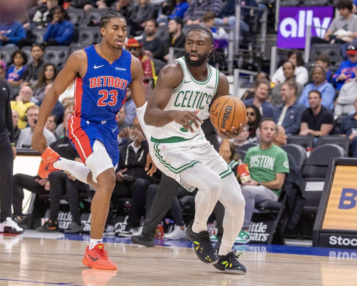 Oct 26, 2024; Detroit, Michigan, USA; Detroit Pistons guard Jaden Ivey (23) defends against Boston Celtics guard Jaylen Brown (7) during the in the first half at Little Caesars Arena. Mandatory Credit: David Reginek-Imagn Images