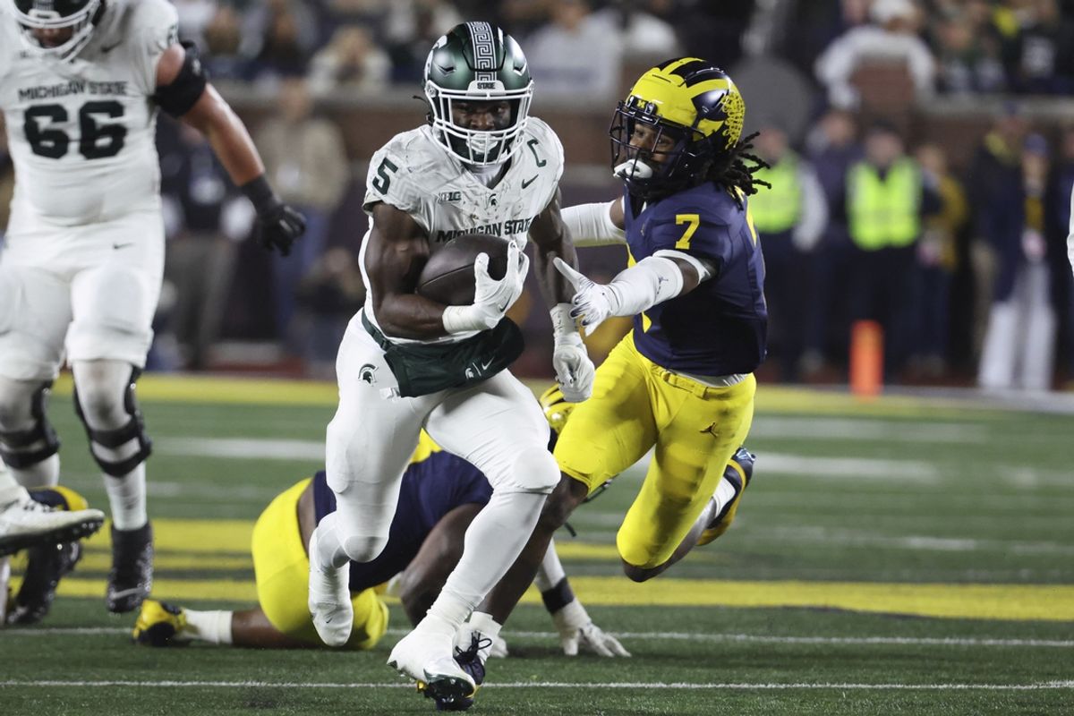 Oct 26, 2024; Ann Arbor, Michigan, USA;  Michigan State Spartans running back Nate Carter (5) rs in the first half against the Michigan Wolverines at Michigan Stadium. Mandatory Credit: Rick Osentoski-Imagn Images