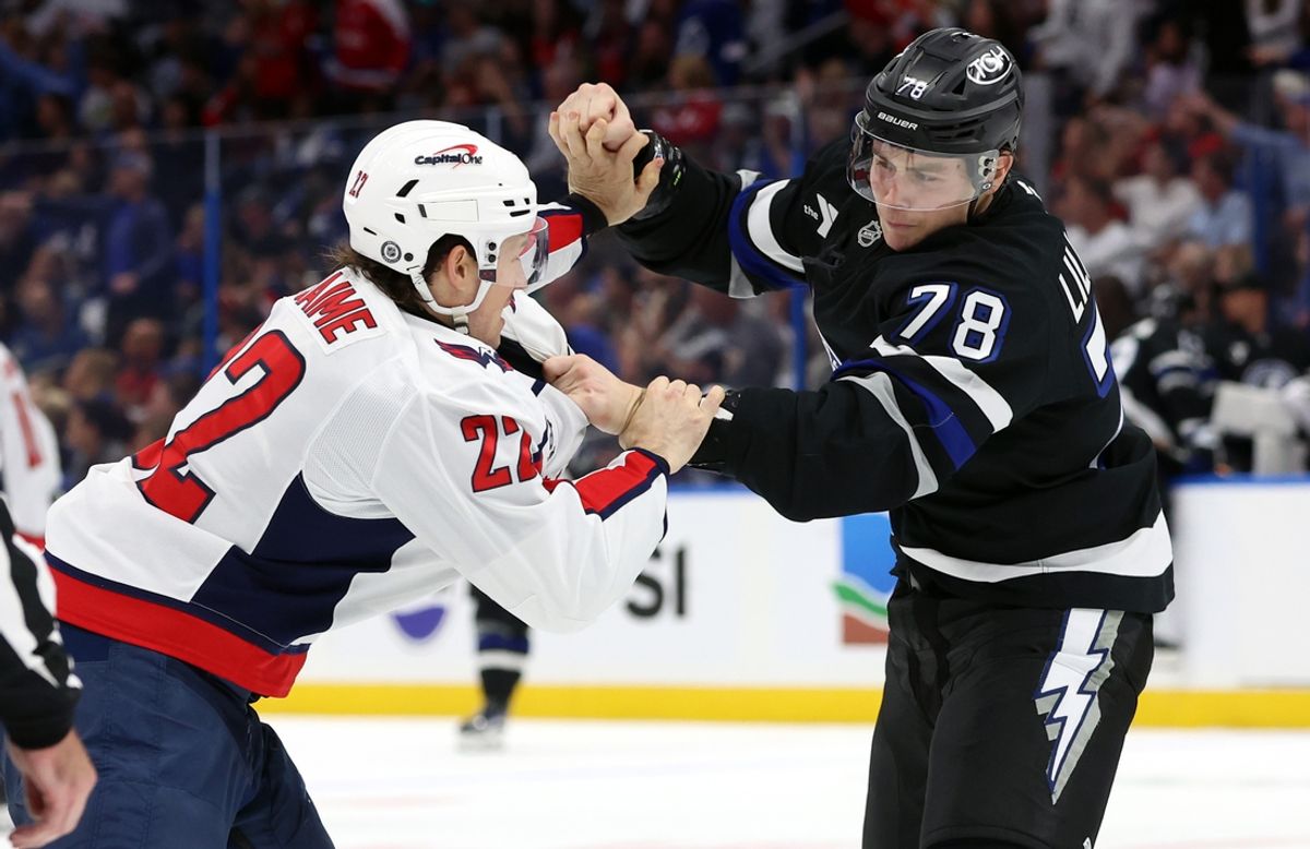 Oct 26, 2024; Tampa, Florida, USA; Washington Capitals right wing Brandon Duhaime (22) and Tampa Bay Lightning defenseman Emil Lilleberg (78) fight during the second period at Amalie Arena. Mandatory Credit: Kim Klement Neitzel-Imagn Images