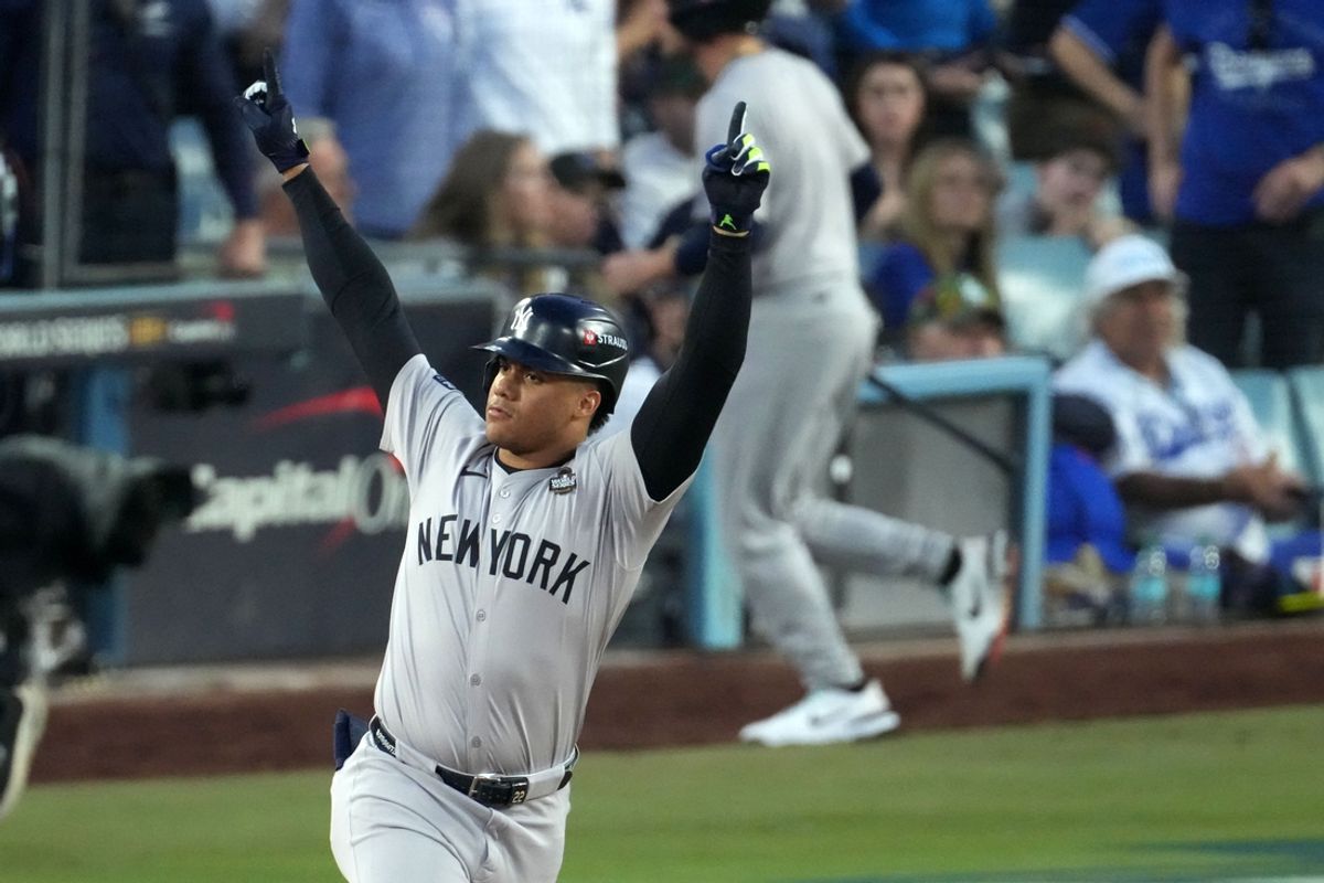 Oct 26, 2024; Los Angeles, California, USA; New York Yankees outfielder Juan Soto (22) reacts after hitting a home run against the Los Angeles Dodgers in the third inning for game two of the 2024 MLB World Series at Dodger Stadium. Mandatory Credit: Kirby Lee-Imagn Images