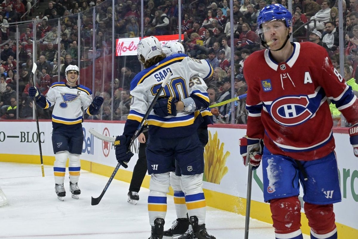 Oct 26, 2024; Montreal, Quebec, CAN; St.Louis Blues forward Jake Neighbours (63) celebrates with teammates after scoring a goal against the Montreal Canadiens during the second period at the Bell Centre. Mandatory Credit: Eric Bolte-Imagn Images