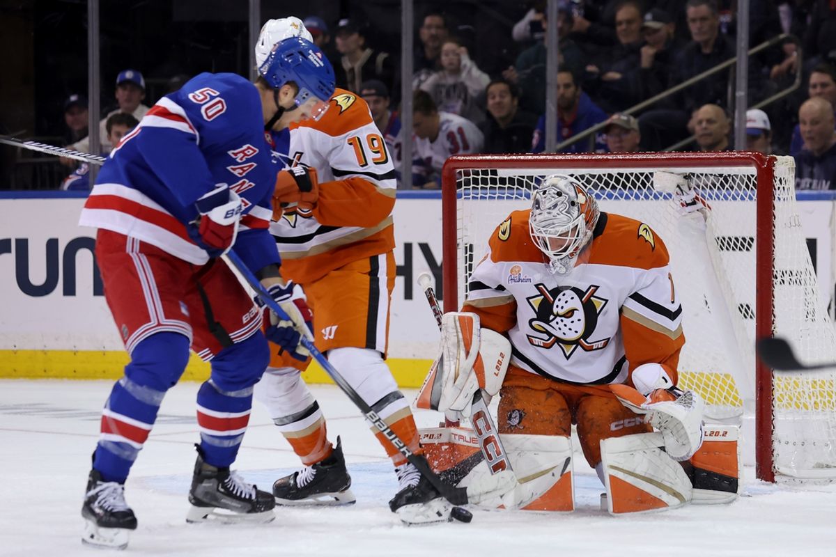 Oct 26, 2024; New York, New York, USA; New York Rangers left wing Will Cuylle (50) takes a shot against Anaheim Ducks goaltender Lukas Dostal (1) and right wing Troy Terry (19) during the third period at Madison Square Garden. Mandatory Credit: Brad Penner-Imagn Images